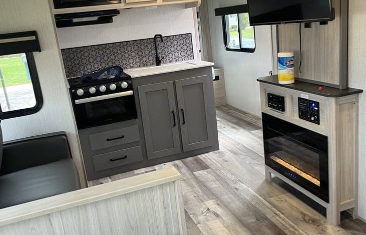 Galley: 3 burner cook top, small stove, sink and microwave