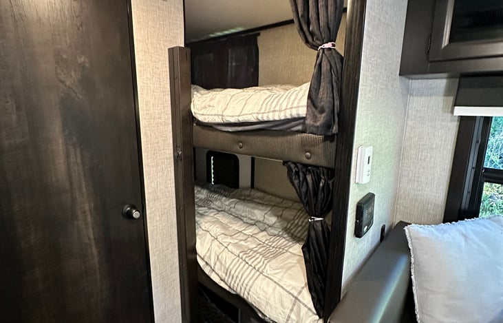 Long comfortable bunk beds with mattress toppers