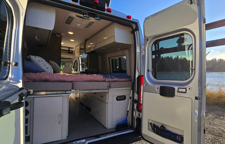 Rear, with bed extended and made. Showing underneath storage.