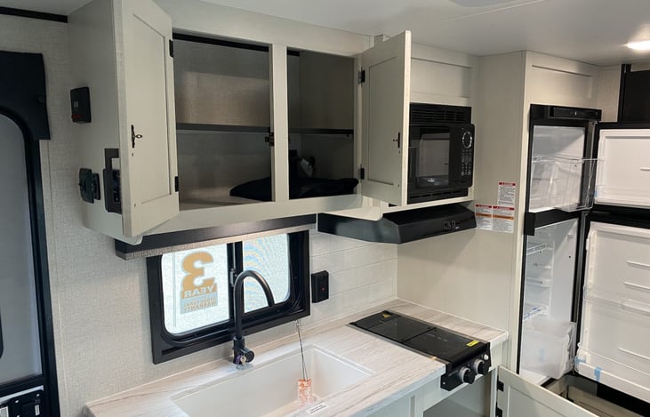 Ample storage in kitchen, cupboards are now well stocked and ready for your trip.