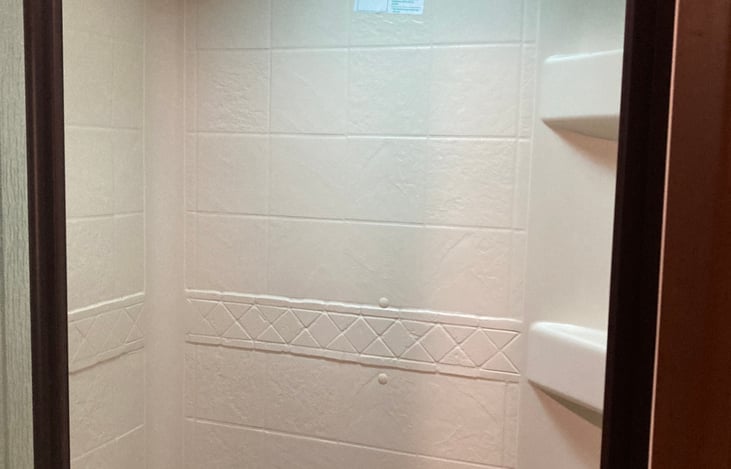 Shower with instant hot water tank