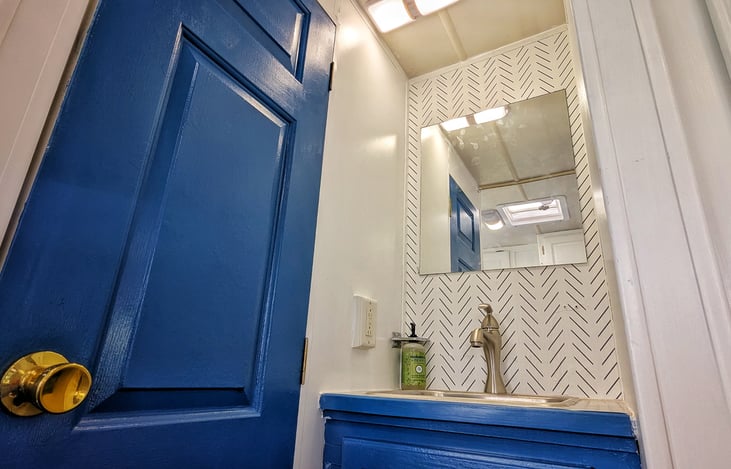 Nice to have the bathroom sink outside the bathroom toilet so someone can brush their teeth while someone else is making deposits.
