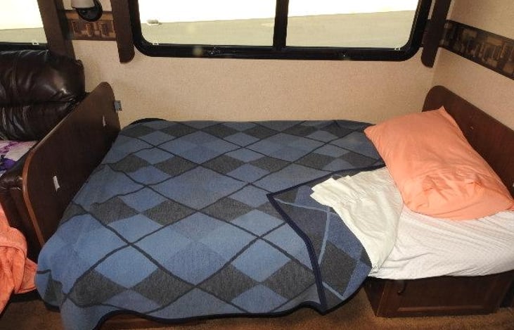 This bed comfortably sleeps one or two adults . A large sleeping bag (queen)provided under master bed storage compartment for added padding for the dinette bed if desired.