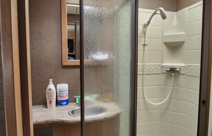 Walk in shower, plenty of hot water with the onboard electric or gas water heater