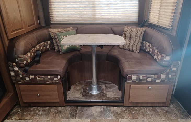 Easily converts to a queen/full bed. Has tucked away seat belts for traveling.