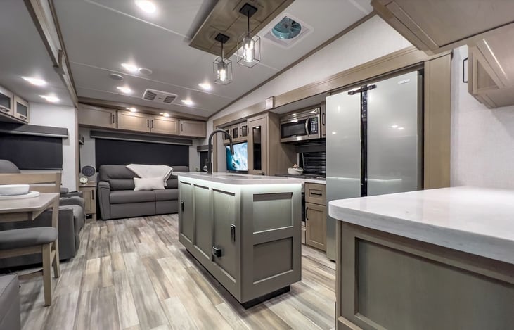 This is manufacturers photo of the inside of the kitchen & living area.  It looks just like this with the island and in the right you see the edge of a counter top.