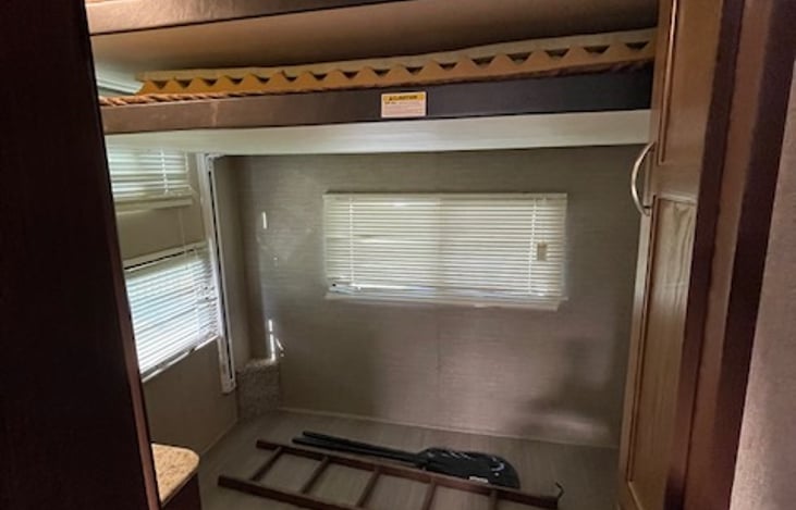 Bunks in the up position.  This area can be used for storage.