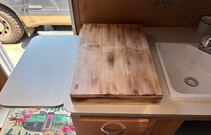 extendable counter and handmade wood cover for stovetop to help with prep space