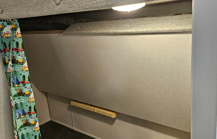 Bottom bunk flips up for added storage or a great place for a dog crate.