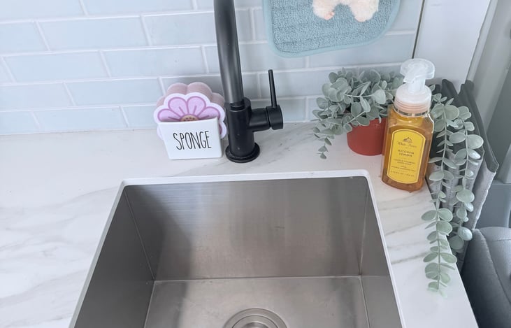 Pump operated sink powered by solar for off grid convenience.