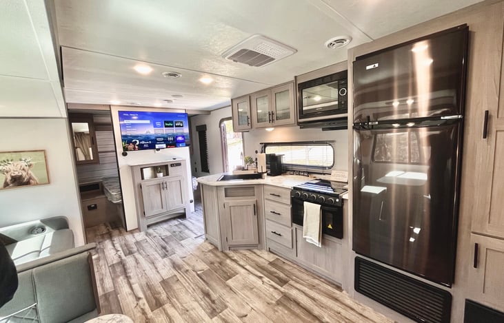 Kitchen~ refrigerator, freezer, plates, mugs, cups, bowls, tupperware, pots and pans, Keurig machine, pot holders, cutting board