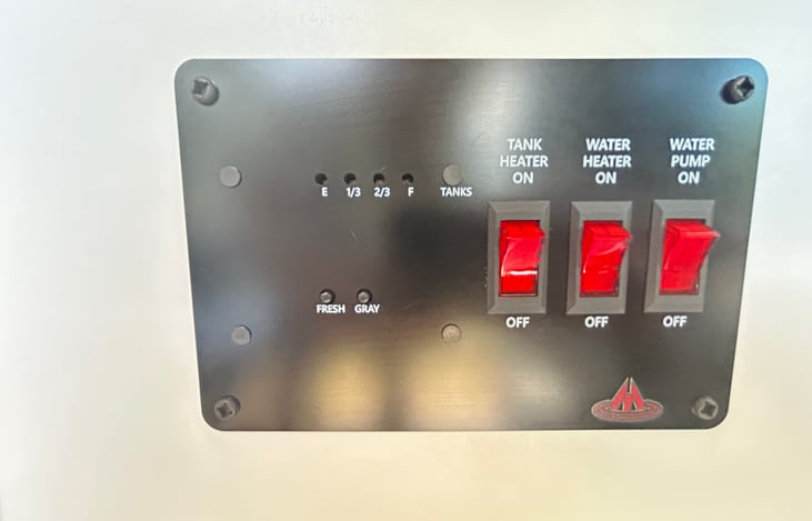 Tank panel.  Instructions will be included, but this is an easy on/off switch to turn on the water pump, water heater pump and tank heater.   You can also see how full(or empty) the tanks are easily!