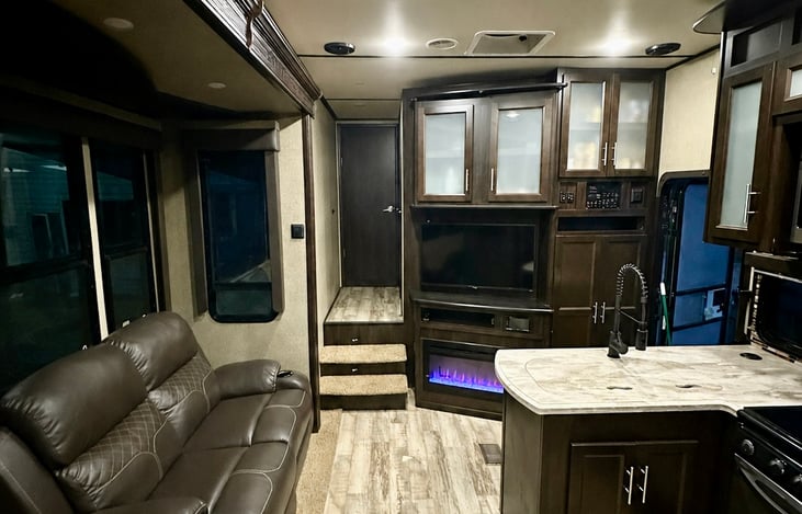 Open space for entertaining friends and family. Electric fireplace with colored backlight. ROKU TV. Heated & massaging couches.
