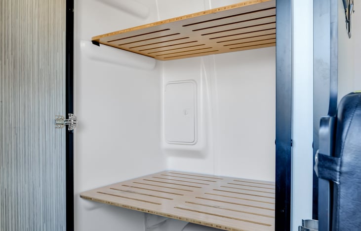 Toilet / indoor shower can be converted to closet configuration for more storage