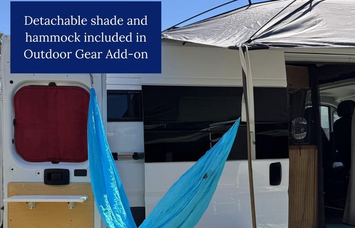 Exterior view of van with the optional gear: detachable shade and hammock in view.