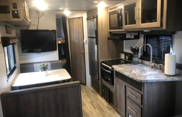 Kitchen, dining table/seat, bunk beds and bathroom