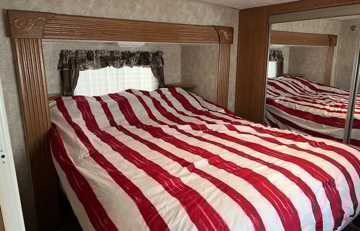 Master bed. Full size queen bed.