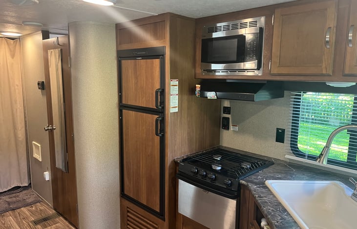 Gas stove over and microwave.