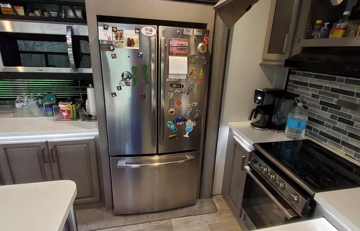 Left of refrigerator is a Microwave/convection oven.

Residential 18 cu ft
