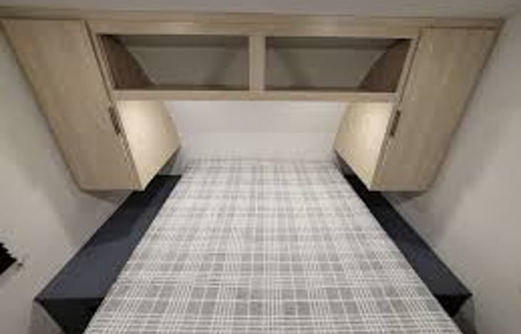 Queen bedroom with private access to bathroom, large closets.