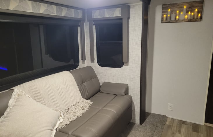 Living room couch that also pulls out into a double sleeper. Fits one perfect, two is a little tight but do able.