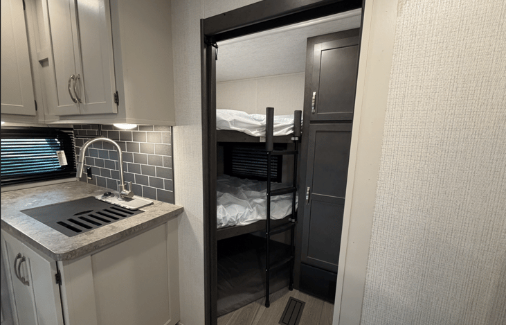 Triple bunks in the back are great for stacking lots of family and friends on camping trips!