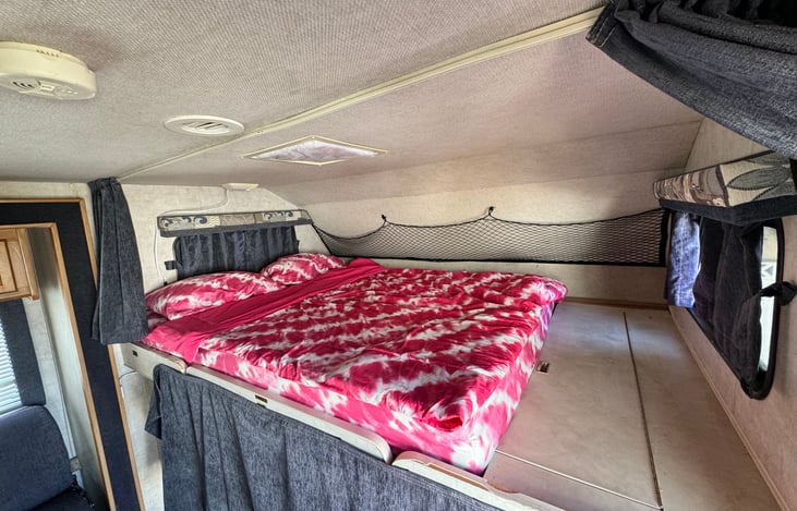 spacious two person sleeping option above driver-cabin