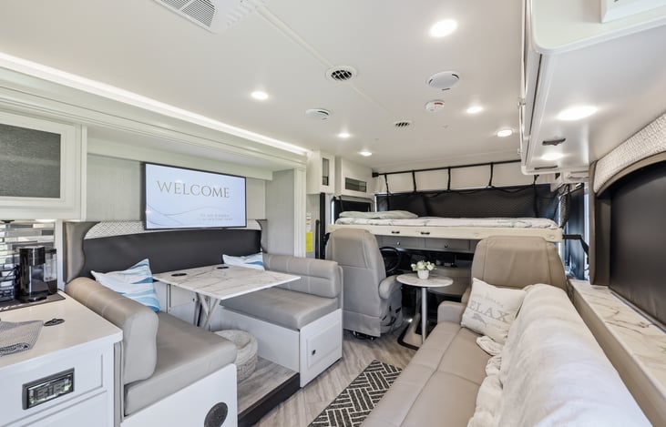 Drop down queen size  bed over drivers area.  Big enough for 2 adults