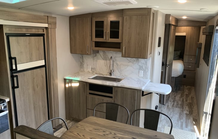 Large kitchen sink, refrigerator, and freezer