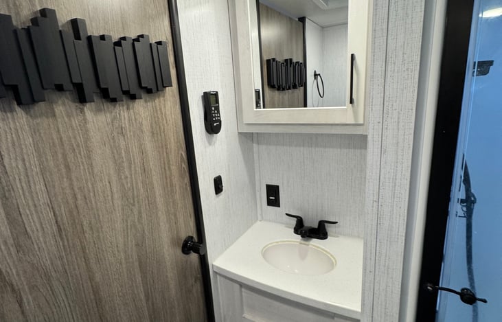 Bathroom sink with medicine cabinet.
