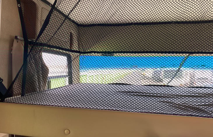 Accommodates 2 guests, goes up and down with power switch.