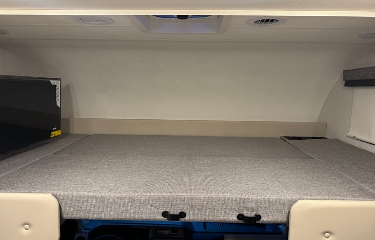 Climb into the LARGE 52" x 96" bunk over the cab for a peaceful nights sleep.