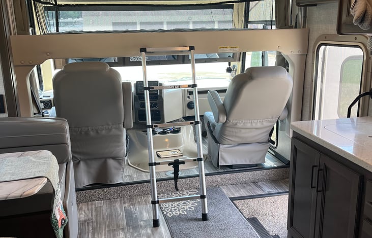 Full size bed above driver