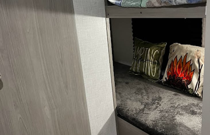 Bottom Bunk has under bed storage for clothes or other items.