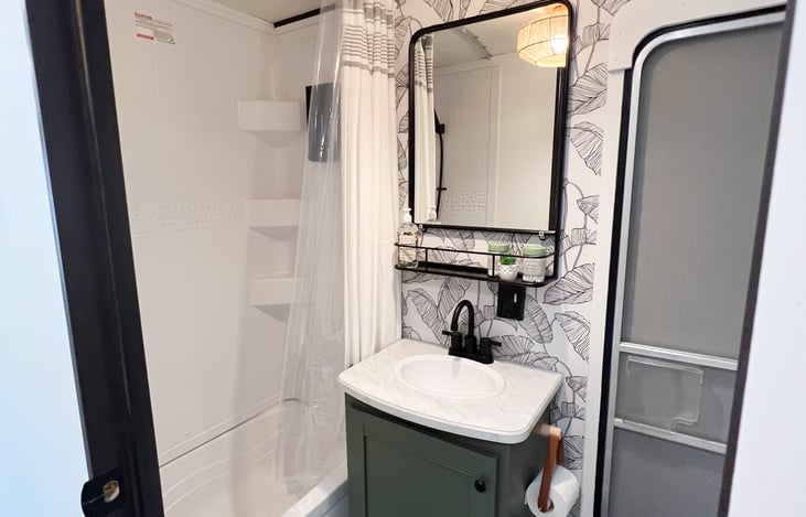 Discover a space equipped with all the essentials, including a toilet, sink, shower, and even a small tub. Experience convenience and relaxation as you enjoy your camping getaway.