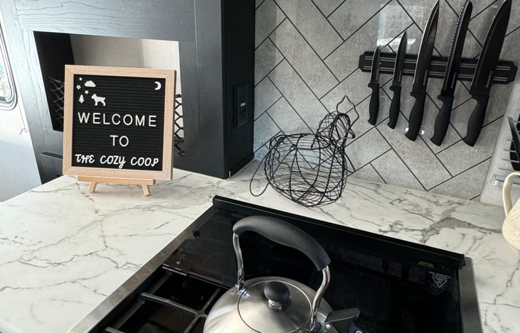 Three burner stove with single rack oven that is thermostat regulated.