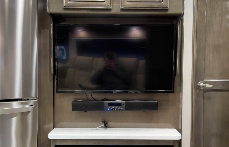 TV across from captain's chairs.