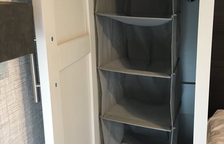 Dual closets flank the private master bed with plenty of hanging and shelf space. Combined with the overhead storage, there's wall-to-wall storage here.