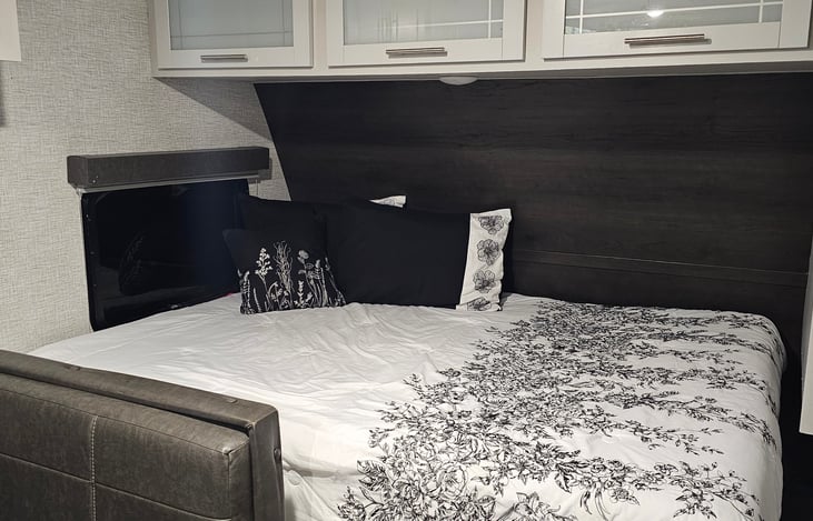 Queen size memory foam mattress. Wardrobe and storage above bed.