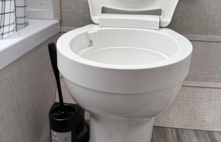 Barely push to put water on the toilet. Push all the way down to flush.