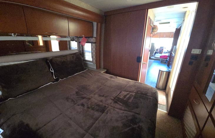 Master bedroom, memory foam mattress all Linens provided for bed one set only towels and washcloths provided in the overhead storage above bed.