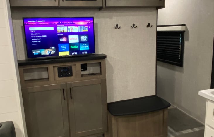 Living Room with Roku TV with surround sound and radio with usb ports and bluetooth capability.  You will need a hotspot to use streaming services.