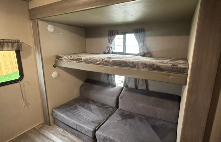 Bunk beds. Lower cushions extend to make more sleeping room!