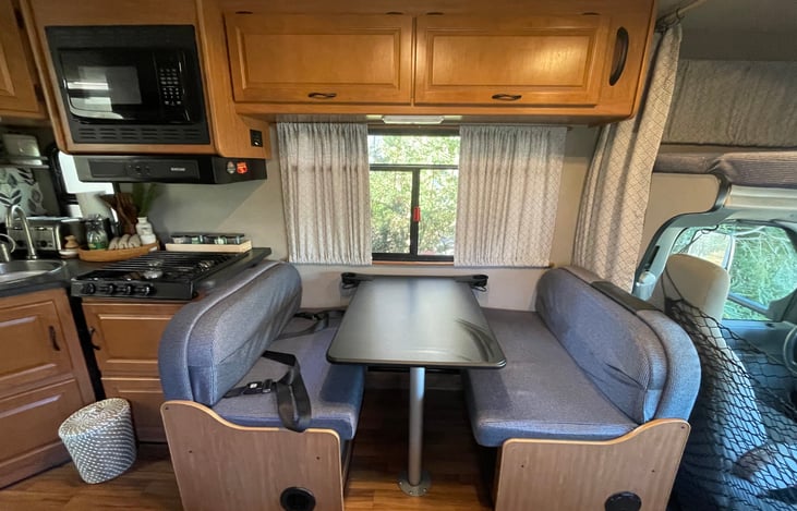 Dinette turns into single bed. Sheets, sleeping bag, and pillows provided.