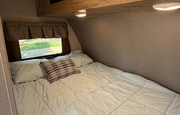 Cozy sleeping space for two with a comfortable full-size bed perfect for relaxing after a day of adventure.