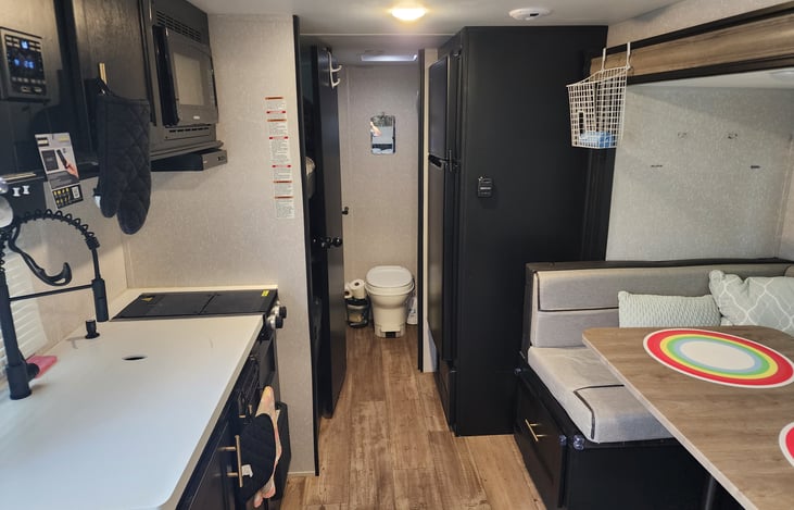 The full length of the Trailer. Enough for your larger friends to still walk through without struggling!