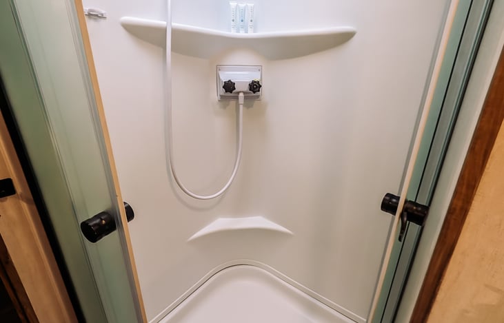 shower in full bath with instant hot water