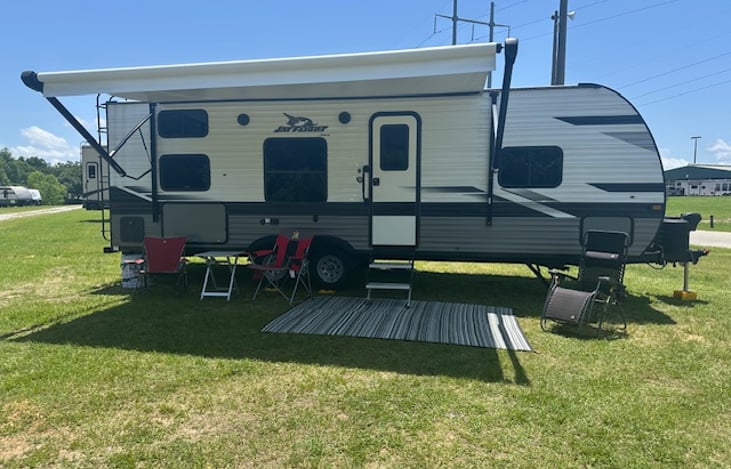 We set up a outdoor mat, table and 3 sitting chairs.