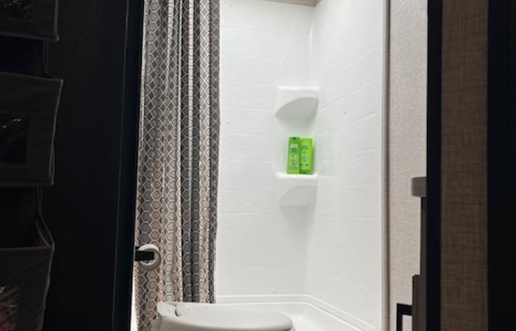 Full bathroom with a shower to accommodate even your tall family and friends!