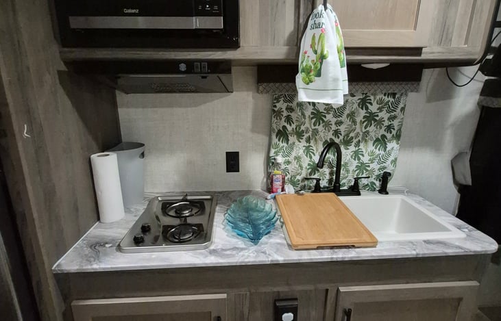 Microwave air fryer all in one, 2 eye gas stove, kitchen sink and full size fridge